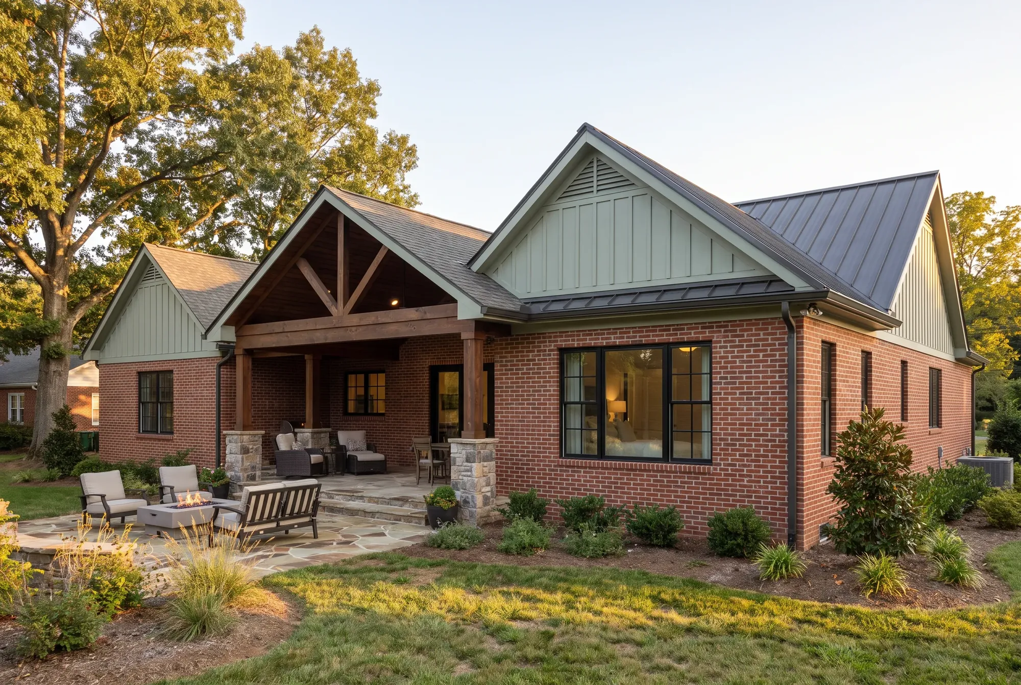 Finished primary suite addition on a brick Tennessee home with matching brick and a new covered porch at evening