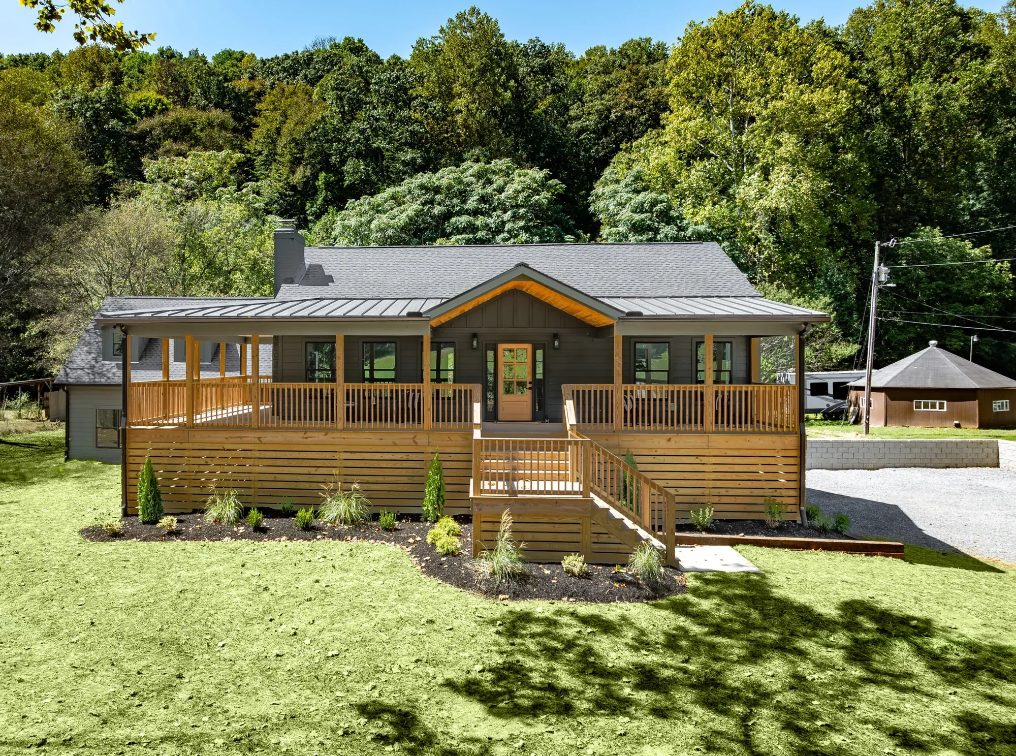 Renovated ranch home with a new wraparound porch built by Southern Belle Construction